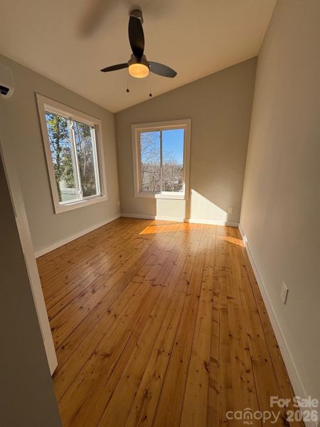 Upper level bedroom, full of natural light, ceiling fan Upper level bedroom, full of natural light, ceiling fan