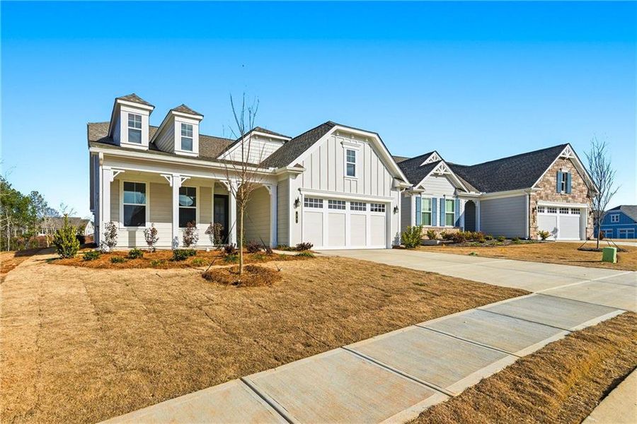 Front exterior of a new home in Cresswind Georgia at Twin Lakes, Hoschton, GA, highlighting curb appeal (Image 23).