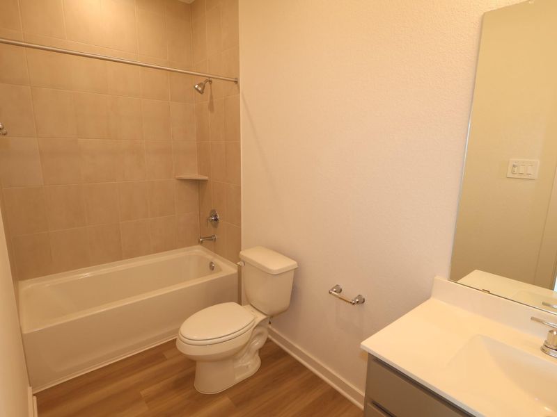 Furnished interior view inside a new home in Lone Star Landing, Montgomery (Image 8).