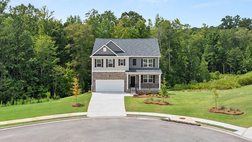 Front exterior of a new home in Locust Grove Station - Cedar Ridge, Locust Grove, GA, highlighting curb appeal (Image 2). Front exterior of a new home in Locust Grove Station - Cedar Ridge, Locust Grove, GA, highlighting curb appeal (Image 2).