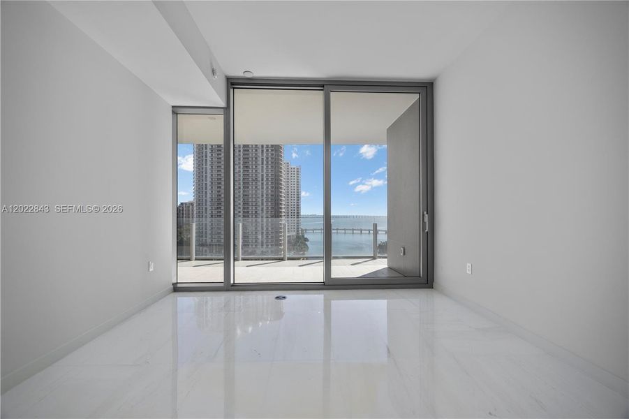 Spacious, unfurnished interior of a new home in Aston Martin Residences, Miami (Image 22).