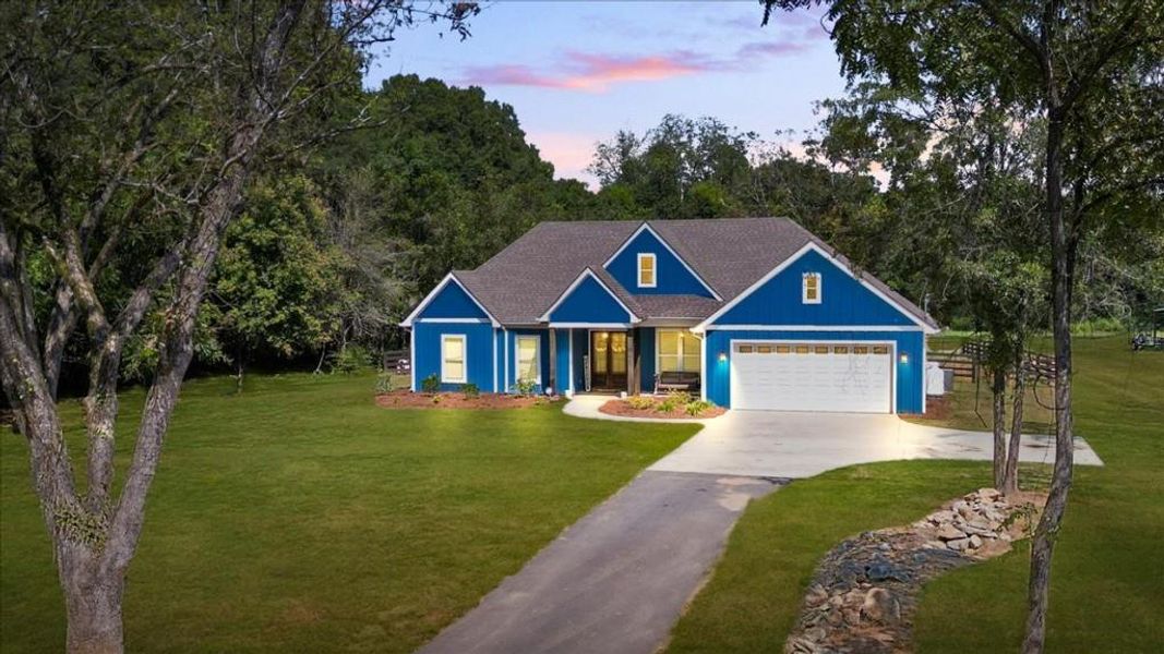 Front exterior of a new home in , Newborn, GA, highlighting curb appeal (Image 2).