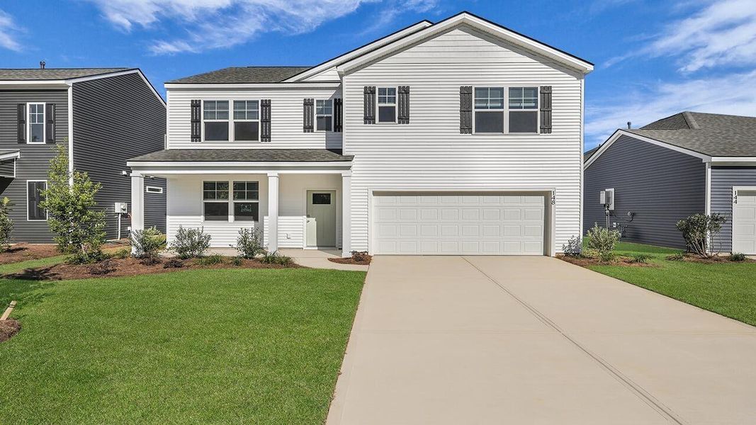Front exterior of a new home in Rivers Reach, Yemassee, SC, highlighting curb appeal (Image 1). Front exterior of a new home in Rivers Reach, Yemassee, SC, highlighting curb appeal (Image 1).