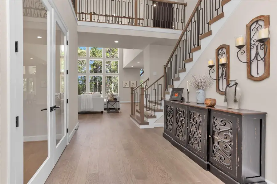 French doors on the left open to a dedicated home office thoughtfully positioned just off the main living areas for convenience and privacy.