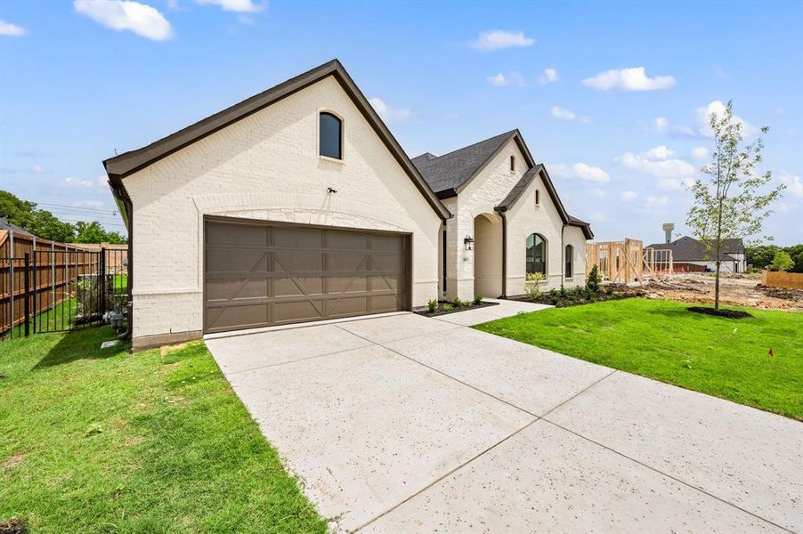 Front exterior of a new home in LeTara, Haslet, TX, highlighting curb appeal (Image 23).