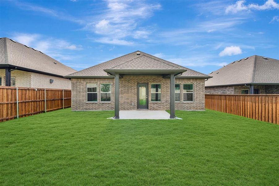 Exterior details and patio area of a home in Aspire at Reunion, Newark (Image 3).