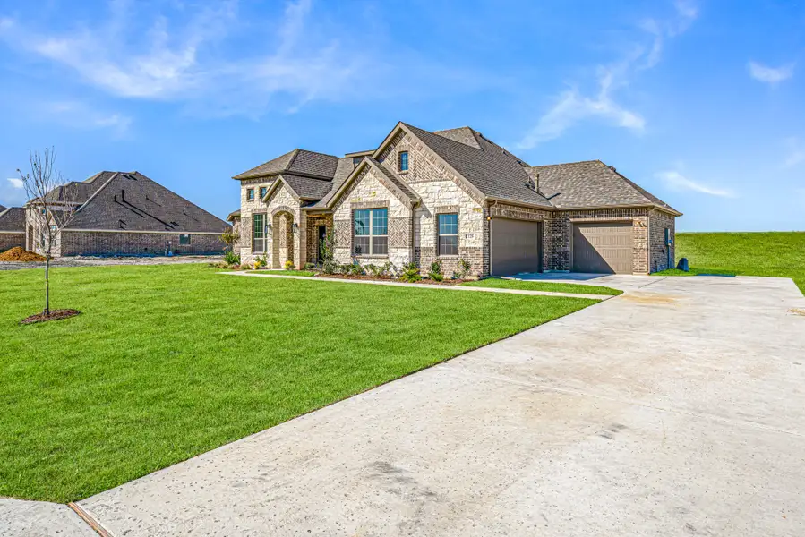 Front exterior of a new home in Levante, Waxahachie, TX, highlighting curb appeal (Image 24).
