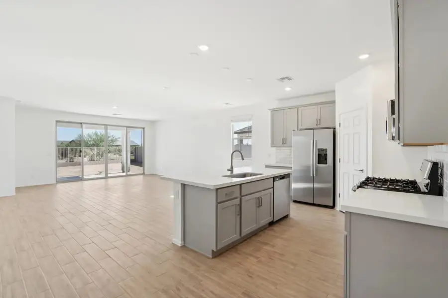 Kitchen and great room. Not actual home, finishes may vary.