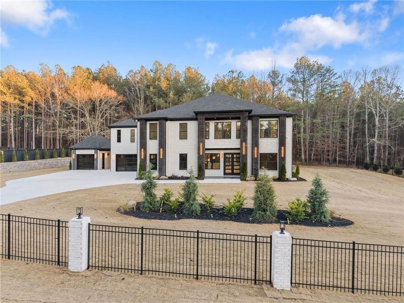 Front exterior of a new home in , Hoschton, GA, highlighting curb appeal (Image 32).