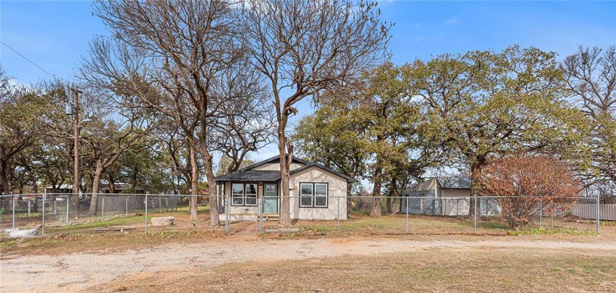 View of outdoor structure with a fenced backyard