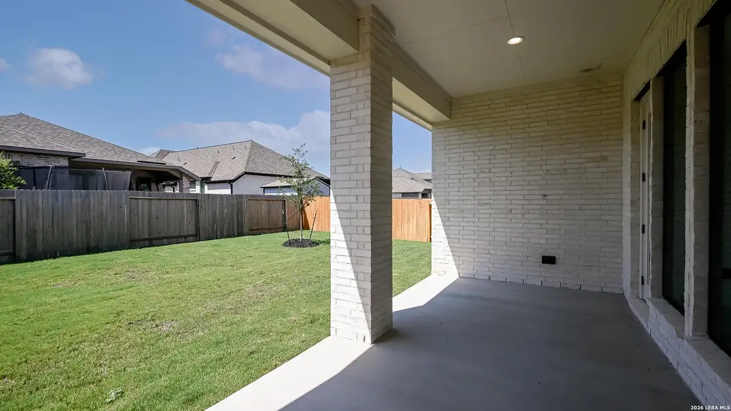 Exterior details and patio area of a home in Meadows of Mill Creek, Seguin (Image 23).