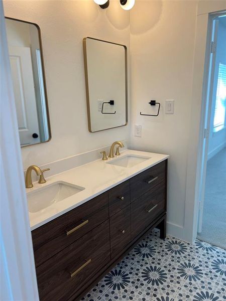 Bathroom with vanity and tile patterned flooring