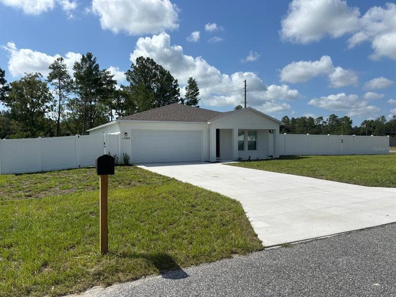 Front exterior of a new home in Marion Oaks, Ocala, FL, highlighting curb appeal (Image 24).