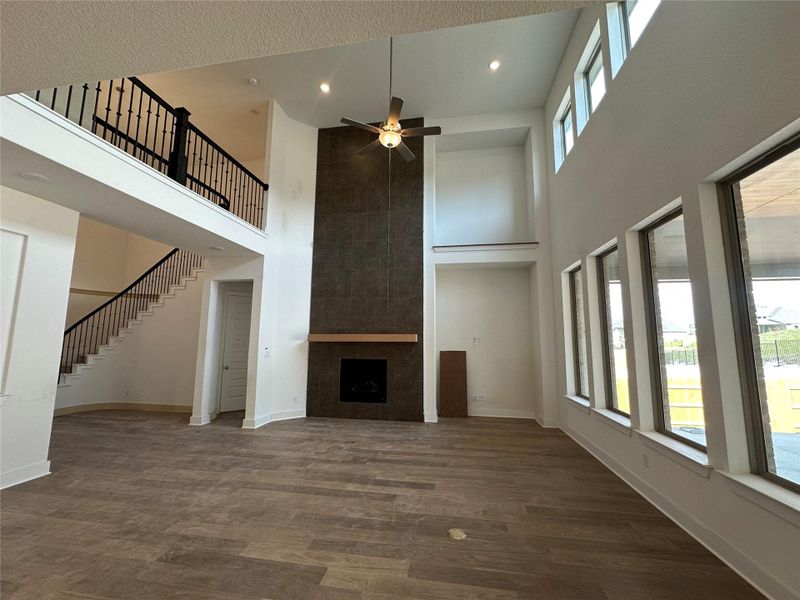 Family Room with soaring ceiling & fireplace