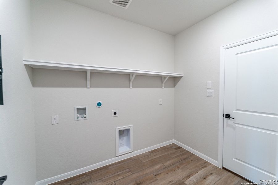 Spacious, unfurnished interior of a new home in The Woodlands at Medina Hills, Mico (Image 18).