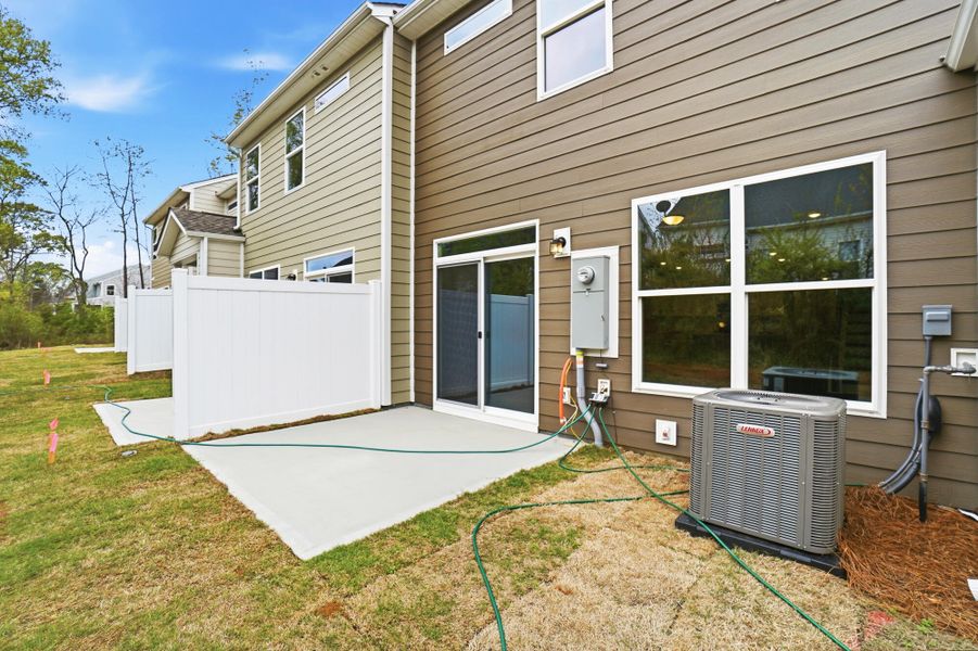 Exterior details and patio area of a home in Harrisburg Village Townhomes, Harrisburg (Image 4).