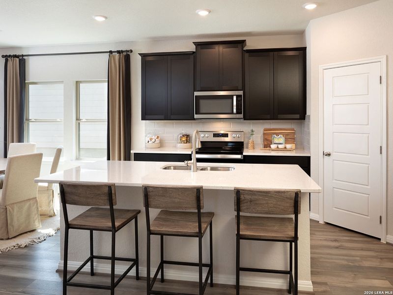 Furnished interior view inside a new home in Estancia Ranch - Premier Series, San Antonio (Image 8).