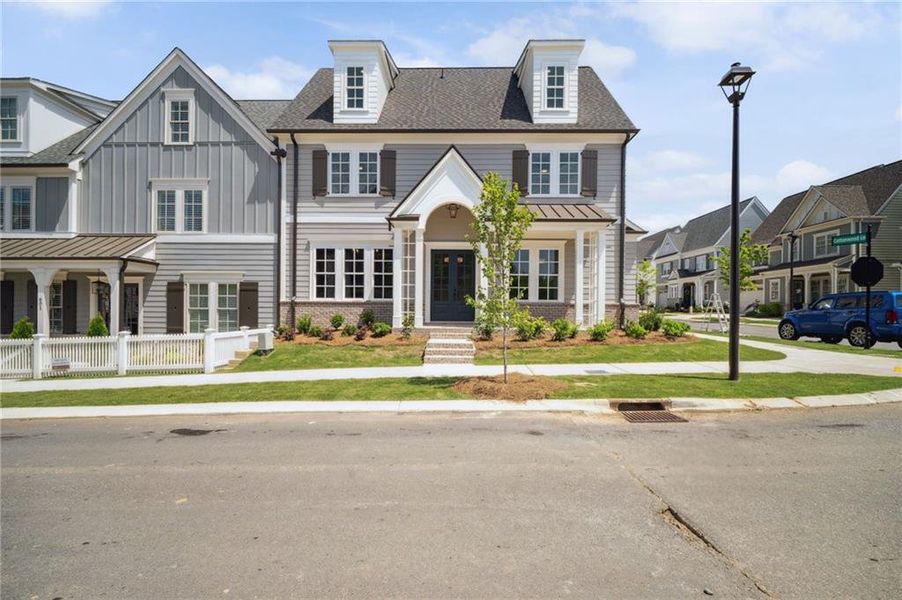 Front exterior of a new home in South on Main, Woodstock, GA, highlighting curb appeal (Image 27).