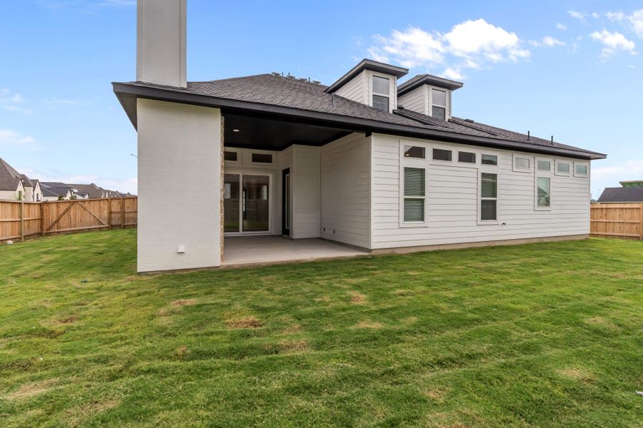 Representative exterior photo of a completed home built from the Brisbane 77′ by Chesmar Homes in Mesa Western, Cibolo, TX (Image 14).