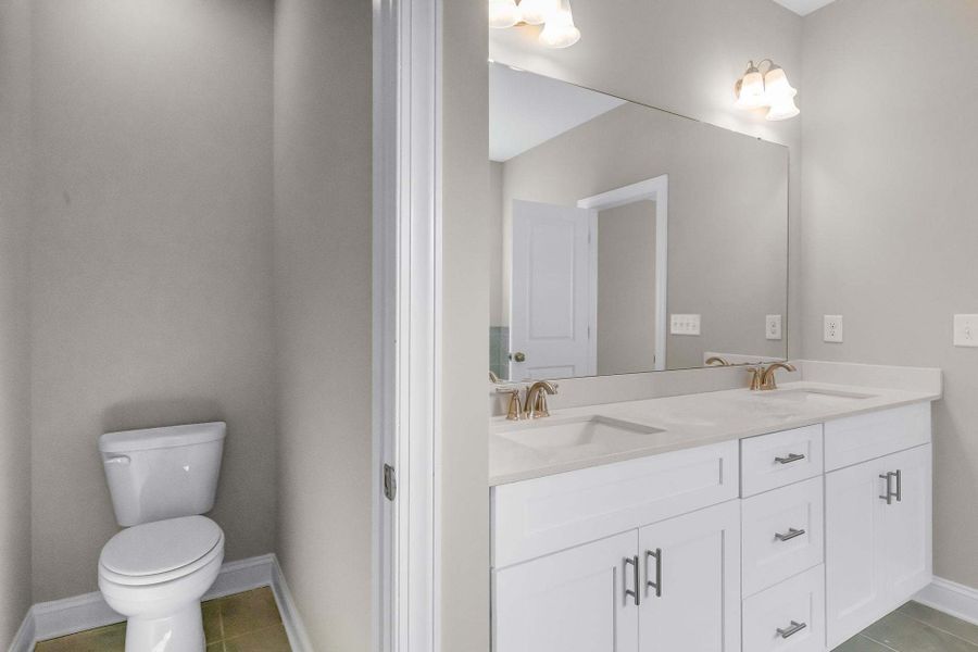 Representative furnished interior of a home built from the Clayton by Caviness & Cates Communities in Bartlett Manor, Youngsville (Image 182).