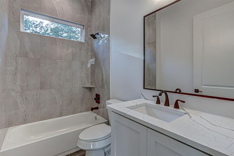 Downstairs Full bath with shower / tub combination and vanity Downstairs Full bath with shower / tub combination and vanity