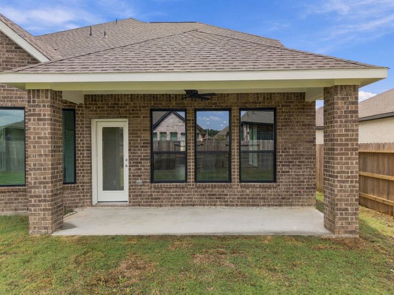 Exterior details and patio area of a home in The Trails, New Caney (Image 25).