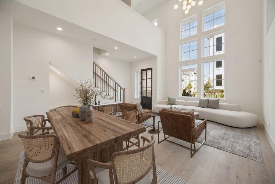 From your kitchen looking back toward your front windows and entrance . Here you can really see all the beautiful light you get from your Floor to ceiling windows And extremely high ceilings.