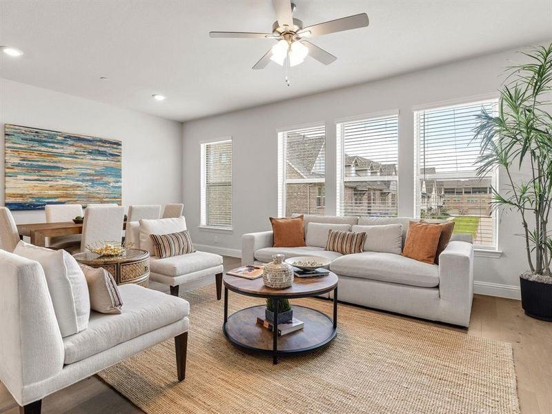 The massive dining zone flows seamlessly into the main living space and effortlessly accommodates a 6-to-8-person table.