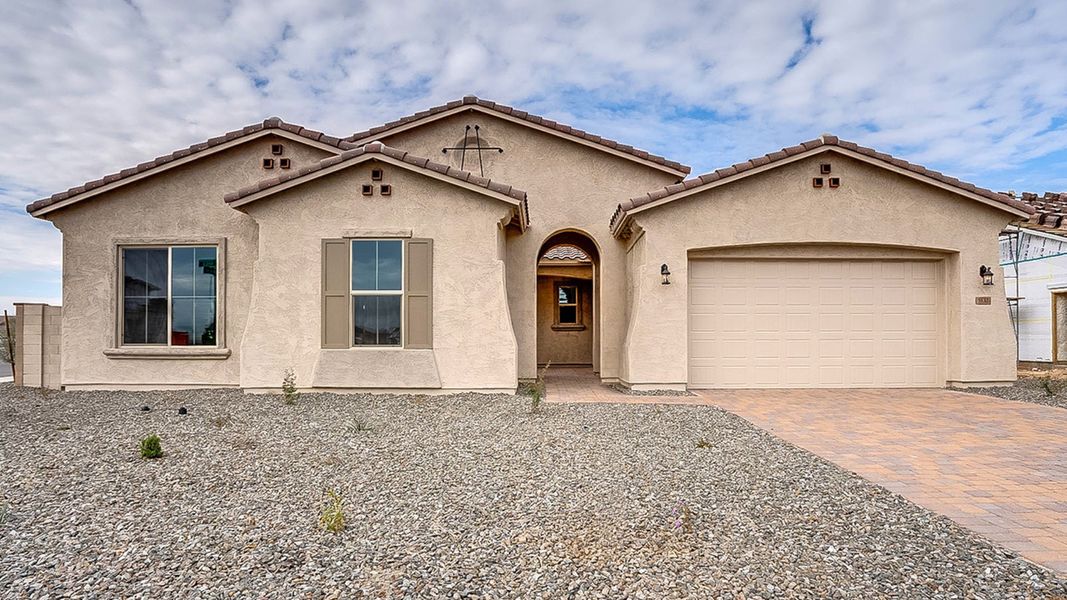Explore Spanish-style desert living at Arroyo Seco in Buckeye, AZ, featuring warm stucco, a clay tile roof and arched entry. Explore Spanish-style desert living at Arroyo Seco in Buckeye, AZ, featuring warm stucco, a clay tile roof and arched entry.