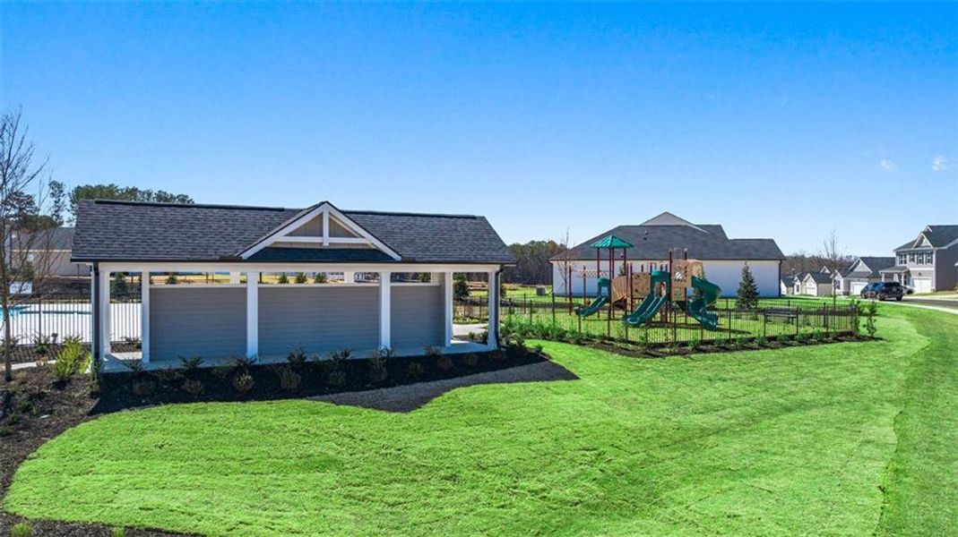 Front exterior of a new home in Champion's Run, Lithonia, GA, highlighting curb appeal (Image 26).