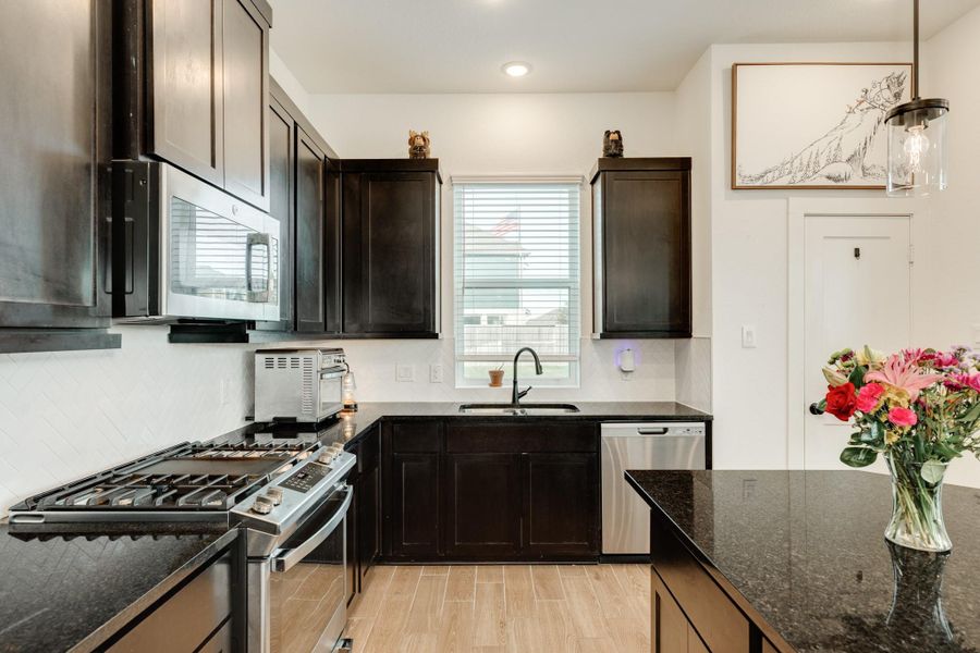 Lots of cabinet space, window over the sink overlooking the fenced backyard