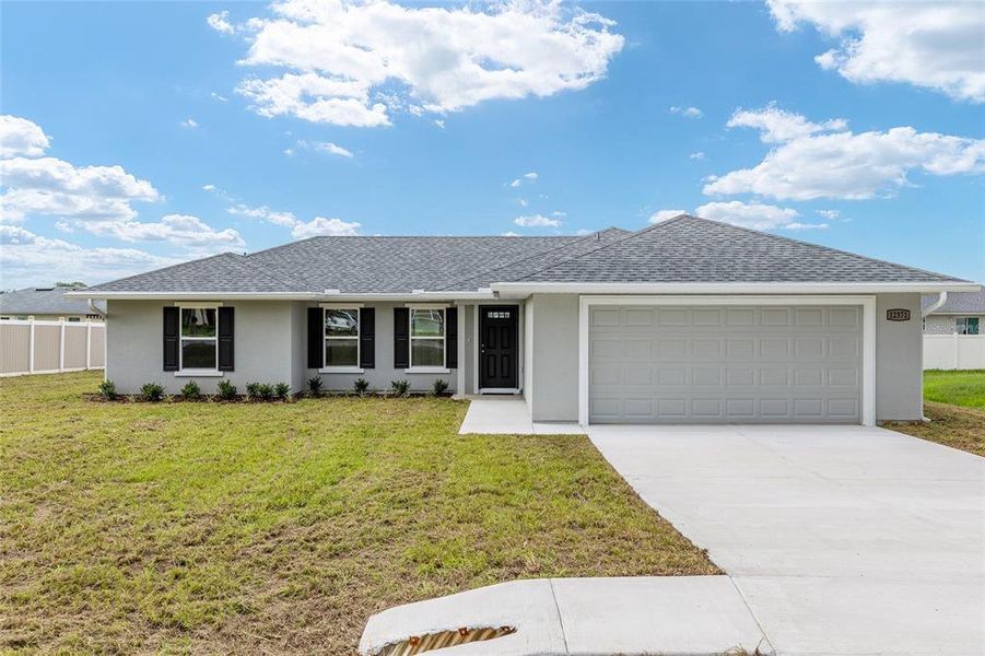 Front exterior of a new home in , Belleview, FL, highlighting curb appeal (Image 2).