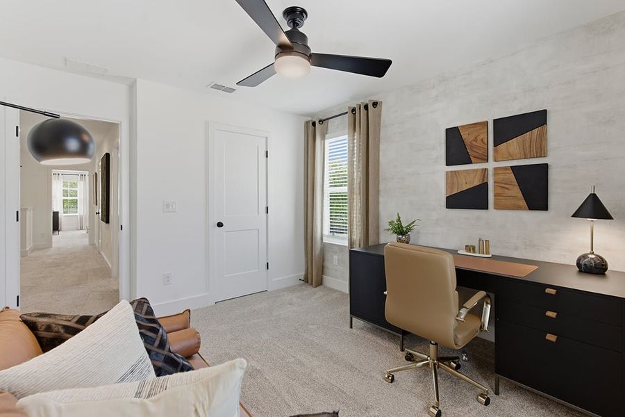 A room with a desk and a chair.