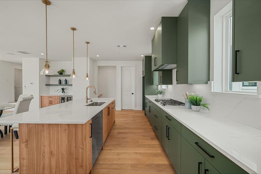 Modern kitchen featuring a spacious island with wood-finish paneling, white countertops, and integrated sink Modern kitchen featuring a spacious island with wood-finish paneling, white countertops, and integrated sink