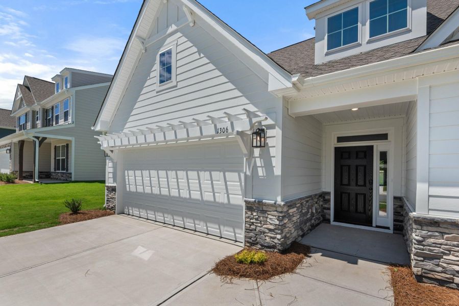 Front exterior of a new home in Wexford, Elon, NC, highlighting curb appeal (Image 26).