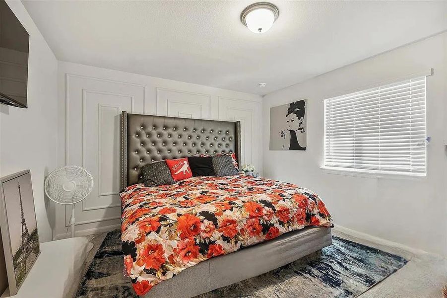 Bedroom featuring carpet flooring