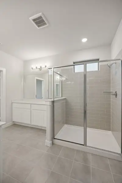 Primary Bathroom in the Wimbledon home plan by Trophy Signature Homes – REPRESENTATIVE PHOTO Primary Bathroom in the Wimbledon home plan by Trophy Signature Homes – REPRESENTATIVE PHOTO