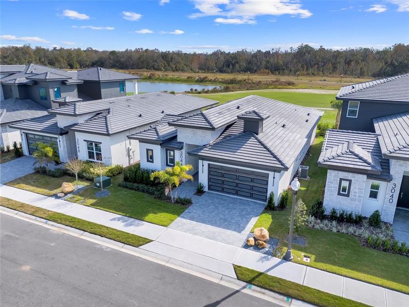 Front exterior of a new home in Hampton Green at Providence, Davenport, FL, highlighting curb appeal (Image 20).