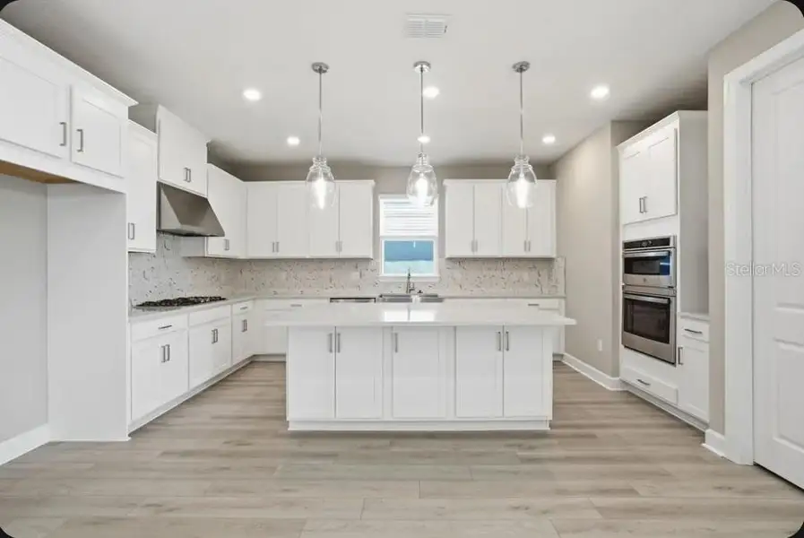 Furnished interior view inside a new home in Coasterra Community Group Page, Palmetto (Image 9).
