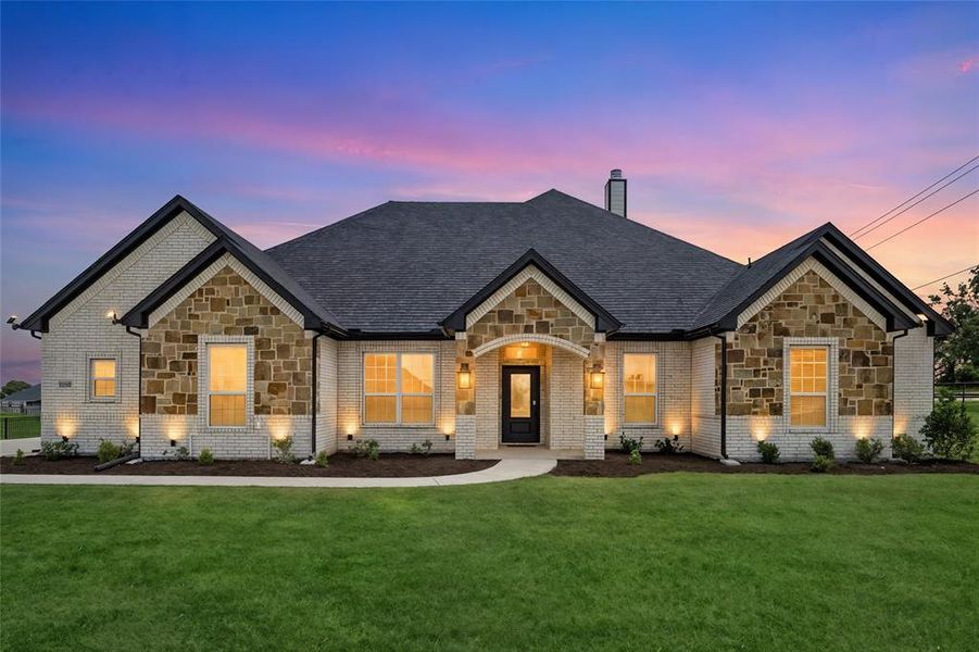 Front exterior of a new home in , Reno, TX, highlighting curb appeal (Image 2). Front exterior of a new home in , Reno, TX, highlighting curb appeal (Image 2).