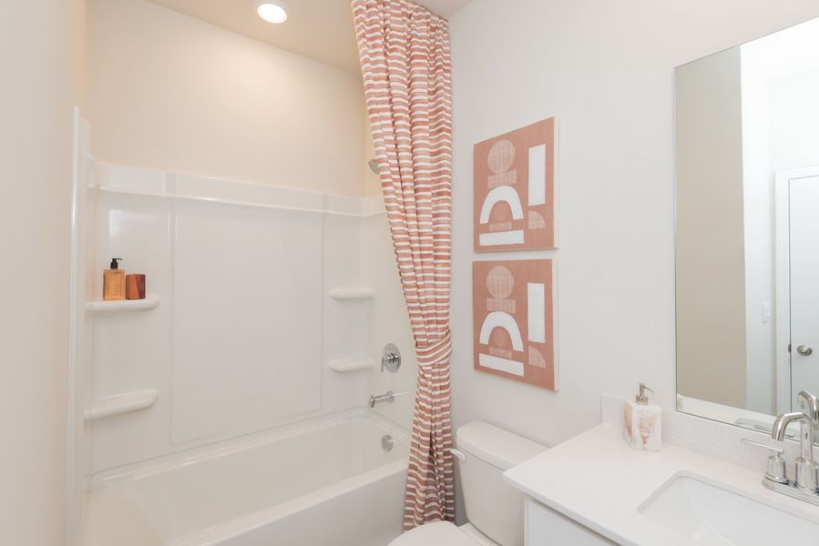 Hosts guests comfortably with a complementary bathroom on the main level.