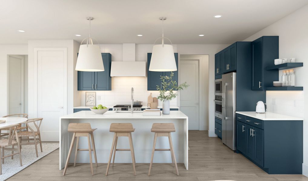 Kitchen with pendant lights & waterfall island