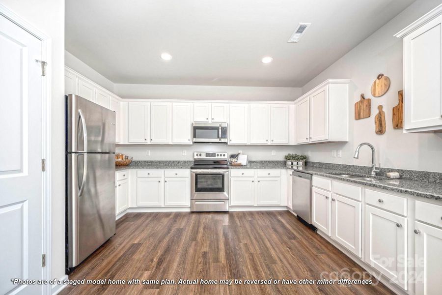 Kitchen with generous amount of cabinets and countertops