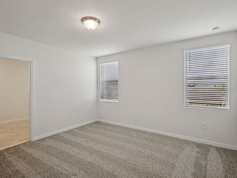 Spacious, unfurnished interior of a new home in Villamar - Signature Series, Winter Haven (Image 10).