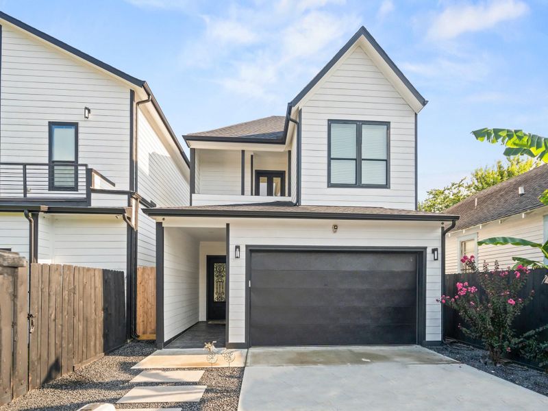 Front Elevation beyond security gate features: grand entry leading to a beautifully 8 ft. exterior iron door, single garage-door w/remote, decreative coach lights, security camera