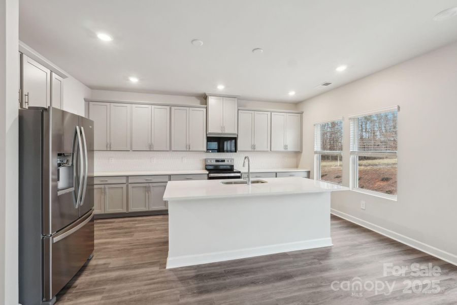 Furnished interior view inside a new home in Harper Landing, Stanley (Image 4).
