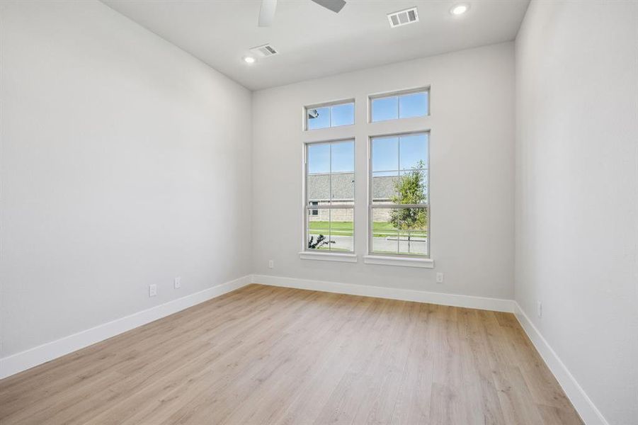 Unfurnished room with light wood-style floors, recessed lighting, and ceiling fan