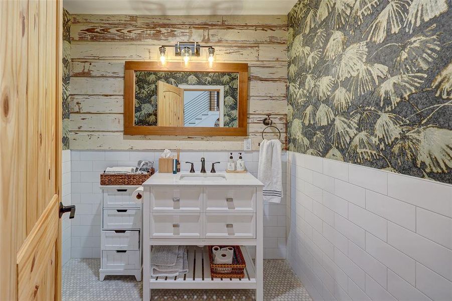 Powder bath off the living area showcases builder's talent for incorporating the old with new by refinishing & reinstalling a piece of the original bunglaow's exterior. 94 San Saba St, Austin TX 78702 MLS# 7207900