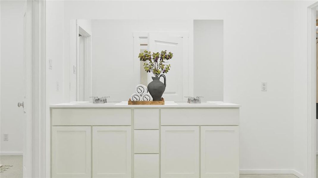 Bathroom with baseboards and double vanity Bathroom with baseboards and double vanity