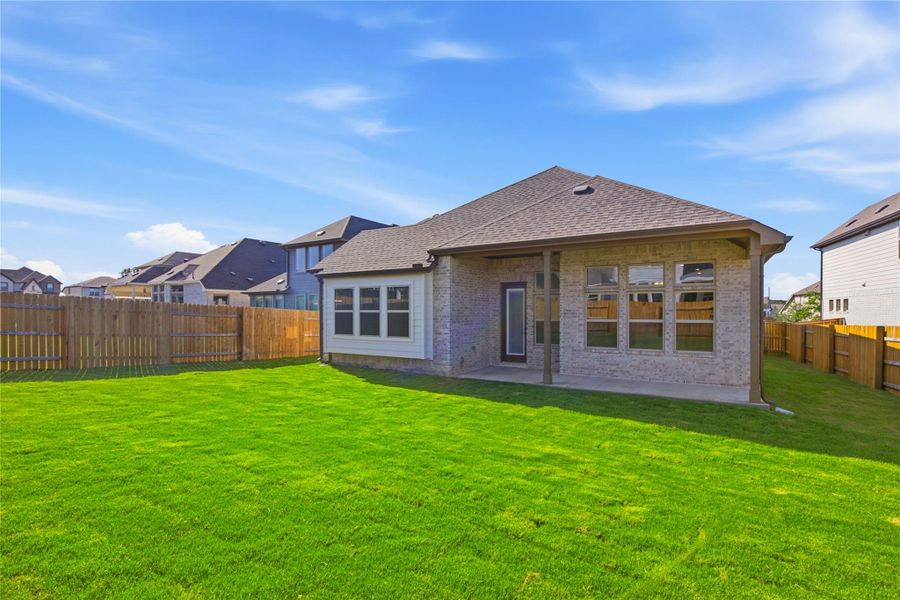 Exterior details and patio area of a home in Oaks at San Gabriel, Georgetown (Image 20).